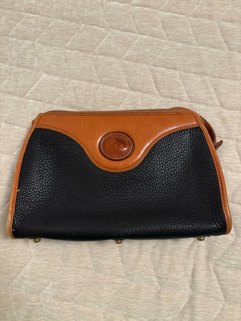 Dooney & Bourke Black and Tan Pebbled Leather Clutch